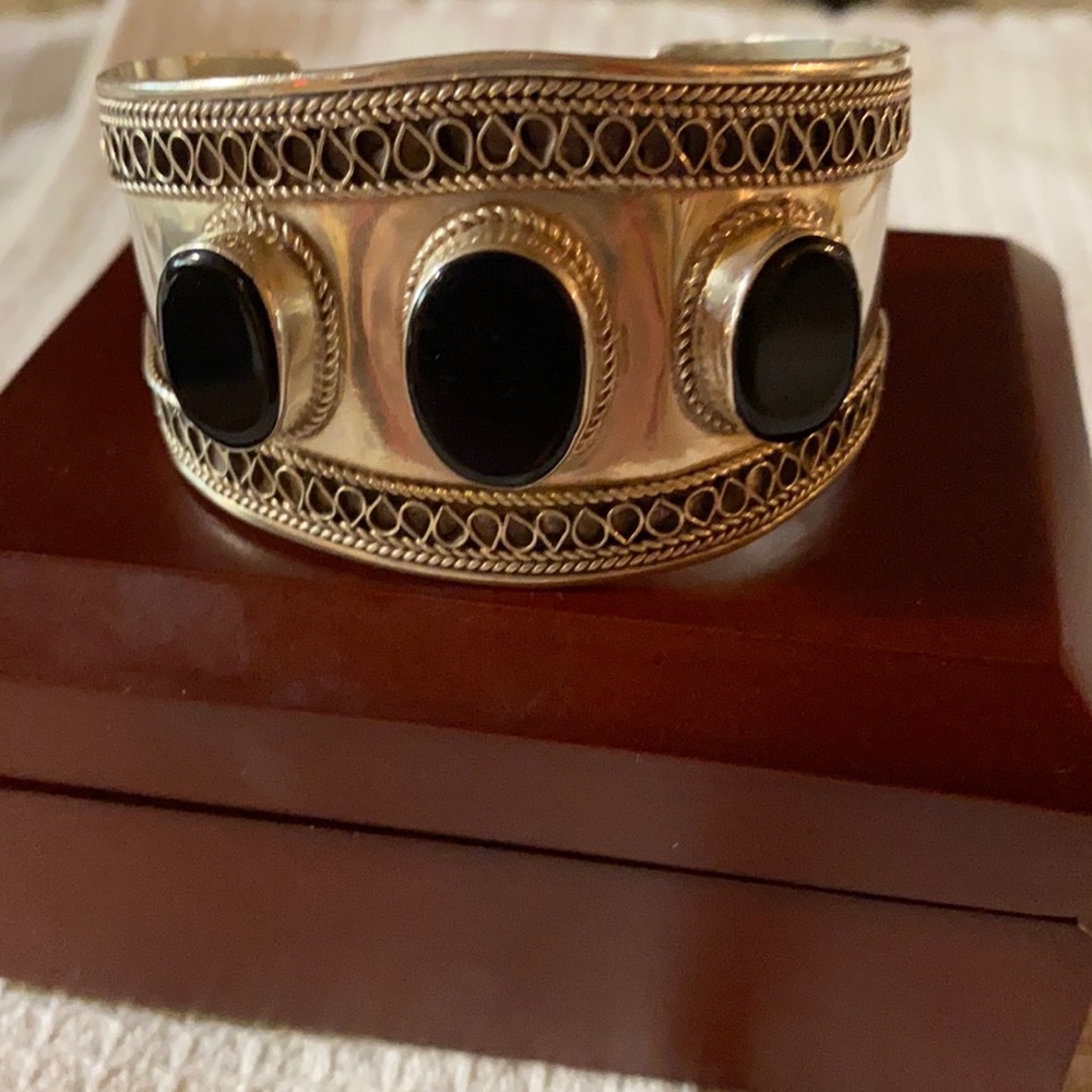 Bracelet Sterling and onyx cuff stamped 925 genuine onyx absolutely beautiful.